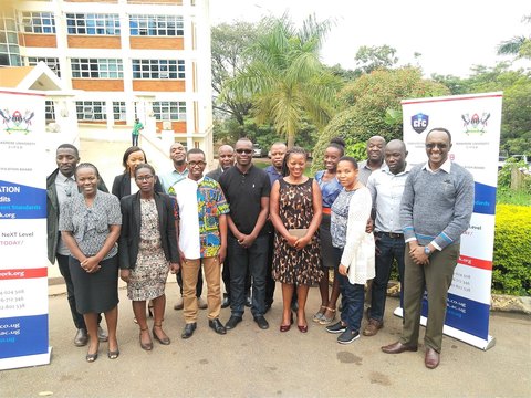 Course participants outdoors beside CFC banners