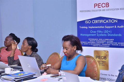 Participants working on laptops during a session